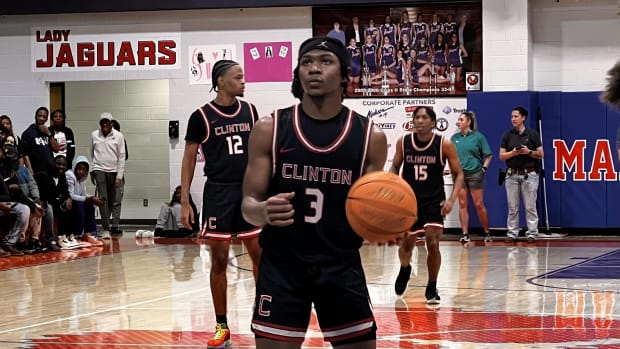 Clinton guard Trey Alexander steps up to shoot a key free throw against Madison Central in Friday night's regular-season finale road win over the Jaguars.